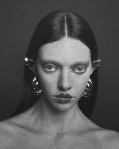 Rachael wears earrings by Alexander McQueen. - © System Magazine