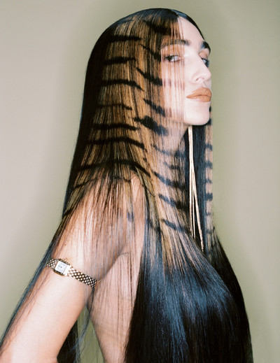 Valentine wears watch by Cartier and earring by Mugler. - © System Magazine