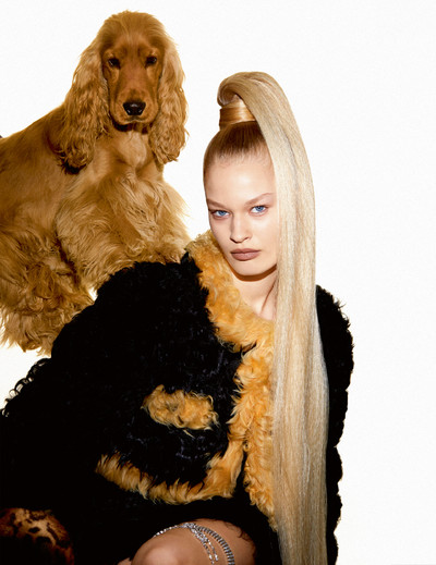 Britt wears jacket, skirt and garter by Chanel, and faux-fur cuff by Haley Wollens Studio. - © System Magazine