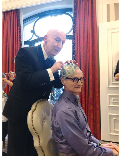 An immoderate aesthete. Hamish Bowles. - © Left: St. Regis Hotel; Right: Metropolitan Museum of Art, New York, 3 May 2019.
&lsquo;Stephen Jones is fitting the Swarovski lilac crystal tiara he designed for me to accessorize the ensemble created by John Galliano for Maison Margiela Artisanal haute couture that I wore to the Met Gala, *Celebrating Camp: Notes on Fashion*.&rsquo;, System Magazine