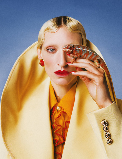 Maggie wears red and gold resin dome earrings, light yellow wool silk mix jacket, and citrus organdy frill shirt, all by Casablanca. - © System Magazine