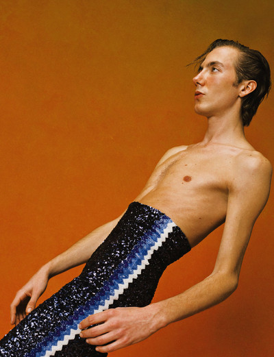 Paul wears navy embroidered matador trousers by Casablanca. - © System Magazine