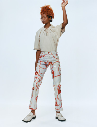 Momentum. Martine Rose & Tamara Rothstein. - © Shiva wears gathered-neck polo shirt, telephone-print trousers, and white square-toed chain mules, all Spring/Summer 2022., System Magazine