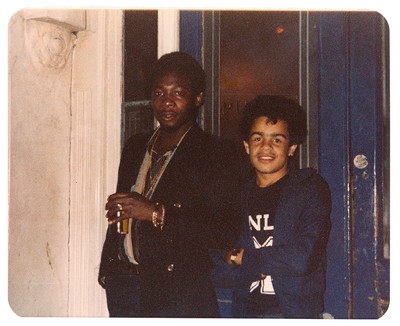 1985. [Left] ‘My older brother Richard in nan’s house, [right] and with his friend, Soljie, outside the house.’ - © System Magazine