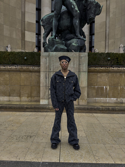 Pharrell. In Paris. - © Monogram fishnet denim hooded blouson, flared denim pants, sailor hat, and derby shoes., System Magazine
