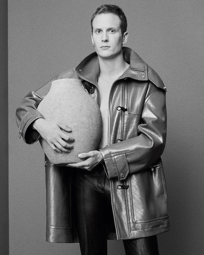 Félix Gesnouin - © Duffle coat with removable hood by Hermès and leather trousers by Rabanne., System Magazine