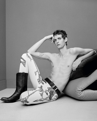 Tom Atton Moore - © Cotton trousers by Stefan Cooke, leather belt by Saint Laurent by Anthony Vaccarello, and leather boots by Prada., System Magazine
