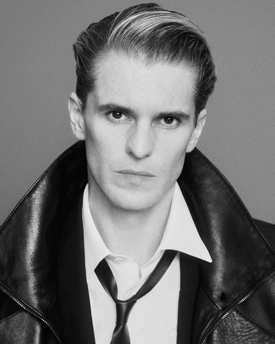 Adrien Dantou - © Bubbled lambskin long coat by Saint Laurent by Anthony Vaccarello, cotton poplin shirt by Louis Vuitton and leather tie by Tom Ford., System Magazine