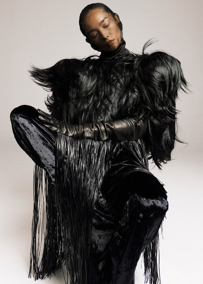 Zhong Lin. - © Coat by Junya Watanabe, top and trousers by Qiuhao, and gloves by Sportmax., System Magazine