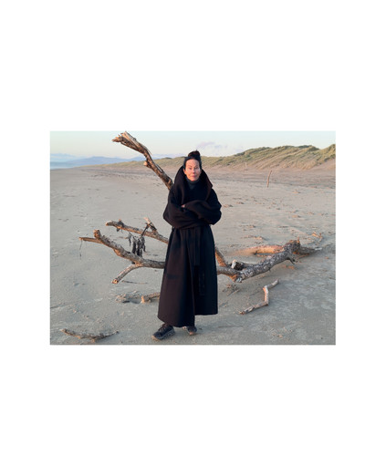 In the words of… Amanda Harlech - © Amanda wears a coat by JW Anderson (Autumn/Winter 2026), her own roll neck by Phoebe Philo, and trainers by ON., System Magazine