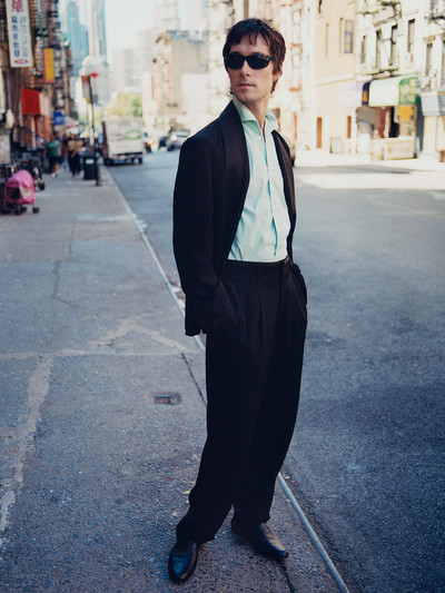 Menswear. Samuel Hine. - © Jacket, trousers and shoes by Loro Piana, shirt by Anderson &amp; Sheppard &times; George Cortina, and sunglasses by Ray-Ban., System Magazine