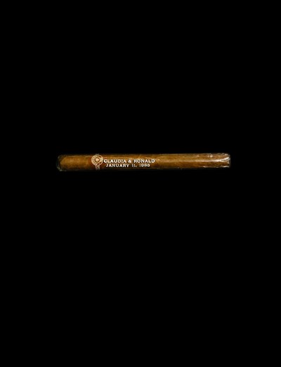 The legendary… Bob Colacello. - © &lsquo;This is a souvenir cigar from Claudia Cohen and Ronald Perelman&rsquo;s wedding party. These were two prosperous, square, conservative Jewish families who *hated* drugs.
Andy arrived with Jean-Michel Basquiat, and Claudia had a fit. I went over to say hello and Andy said, &ldquo;Jean-Michel, you know Bob, right?&rdquo; And Jean-Michel just grunted at me.
He never forgave me for putting Nancy Reagan on the cover of *Interview*. Andy was trying to get Jean-Michel to be nice to me, because they were like pariahs at this dinner. Andy said, &ldquo;Oh, Jean-Michel, Bob likes to smoke pot.&rdquo; He said,
&ldquo;You want some pot?&rdquo; I said, &ldquo;Sure,&rdquo; thinking he was going to hand me a joint. He takes out a huge branch of marijuana and hands it to me! I was so pissed off, thinking, &ldquo;If Ronald Perelman sees me with this in my hand&hellip;&rdquo;&rsquo;, System Magazine