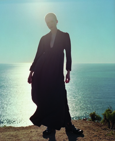 Long-sleeved brown dress by Valentino
Black croc flat-toed lace-up ankle boots from John Moore at The Old Curiosity Shop
Cuff earring by Repossi - © System Magazine