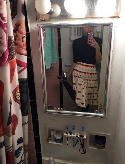 Toilet selfie of Prada Lips skirt (iconic!) and shoes. - © System Magazine